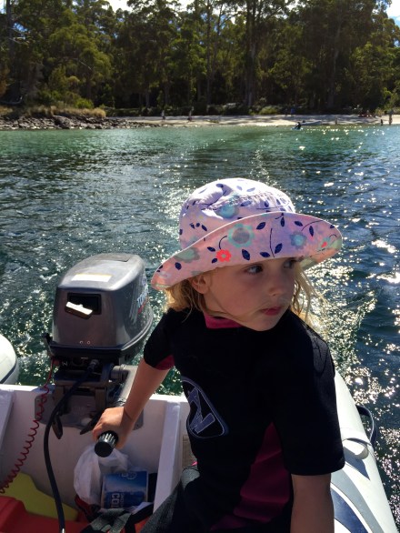 Poppy driving the dinghy